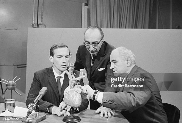 Dr. Christian N. Bernard of South Africa , speaks with Dr. Michael DeBakey and Dr. Adirn Kantrowitz, prior to their appearance on the television...