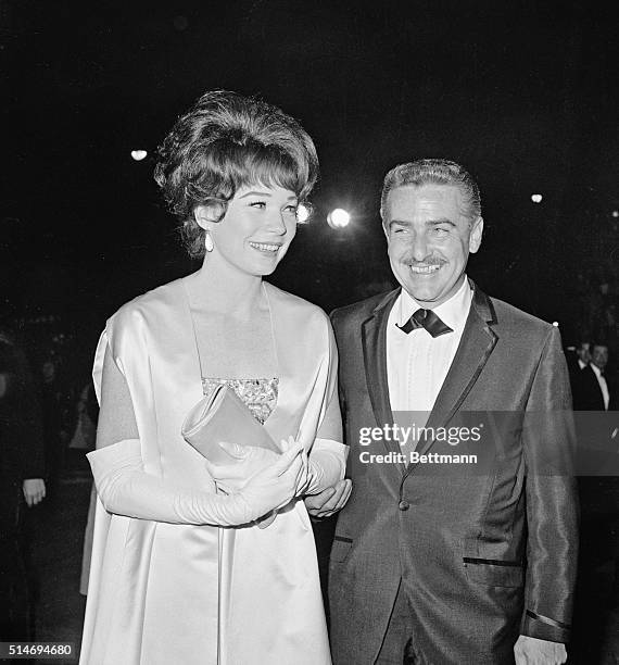 Shirley MacLaine and husband Steve Parker arrive for the 1964 Academy Awards. MacLaine was nominated for the Best Actress Award, for her role in Irma...