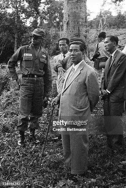 Military advisor Col. McCown accompanies South Vietnam president Ngo Dinh Diem on a tour of the president's summer home in Pleiku.