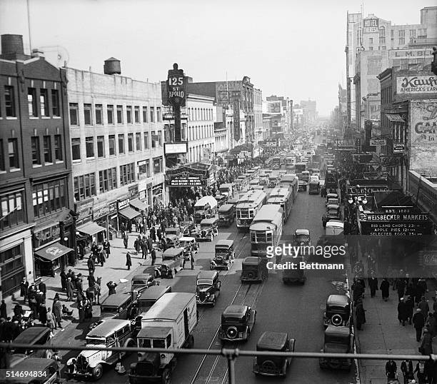 Looking east from 8th Avenue at the traffic and buildings on 125th Street in Harlem, Manhattan. The Apollo Theater is at left. Riots broke out here...