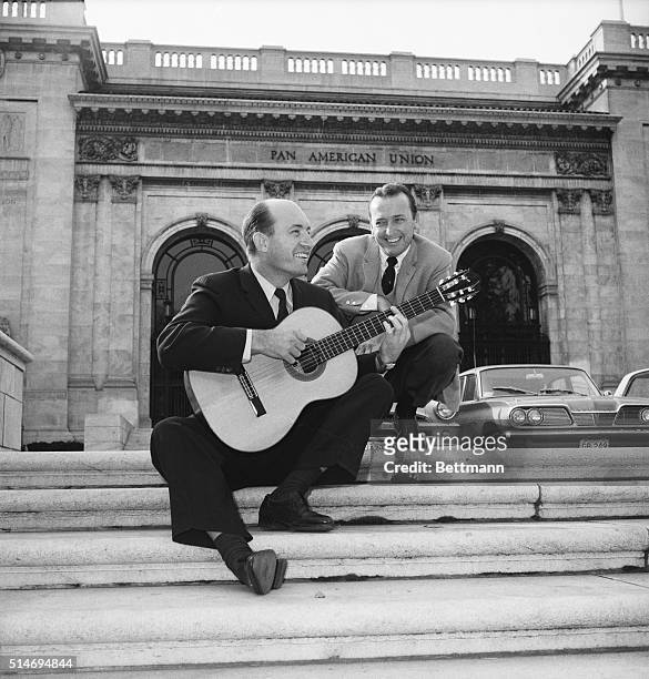 Jazz guitarist Charlie Byrd plays "Bossa Nova" for disc jockey Felix Grant on the steps of the Pan American Union Building in Washington, D.C. |...