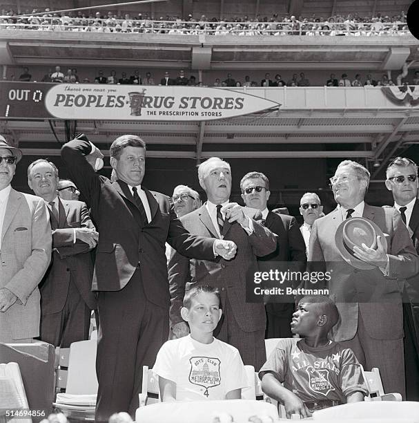 President John F. Kennedy tosses out the ball at the All-Star baseball game in Washington, DC, on July 10, 1962.