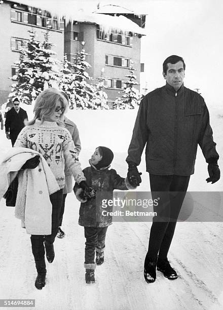 Catherine Deneuve and Roger Vadim enjoy a holiday in the snow, with Vadim's daughter Nathalie.