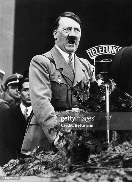 Adolf Hitler,closeup shot of the Chancellor speaking over the radio microphone.