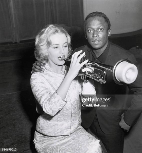 Paris, France: The music goes round and round for French actress Jeanne Moreau, who sends out a few muted riffs on a trumpet in Paris. Her teacher is...