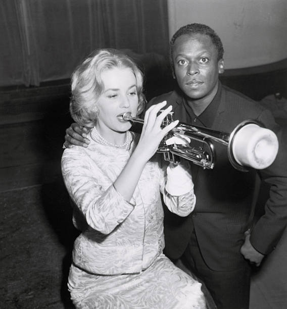 Paris, France: The music goes round and round for French actress Jeanne Moreau, who sends out a few muted riffs on a trumpet in Paris. Her teacher is...
