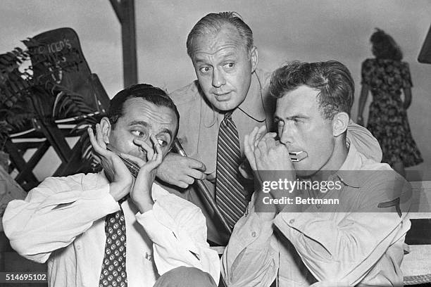 Southwest Pacific: Larry Adler , Harmonica Virtuoso, gets together on a duo with Pfc. Ernest Temple, Chicago, during a show at the American Division...