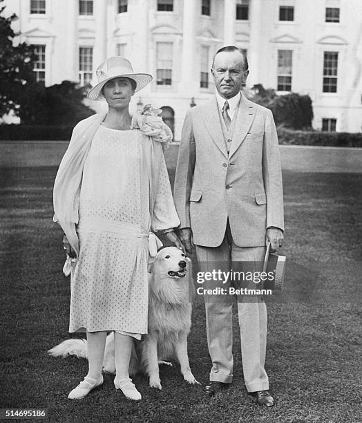 Washington, DC: Above is the first picture to be taken of the President and Mrs. Coolidge on the lawn of the nely decorated White House, which was...