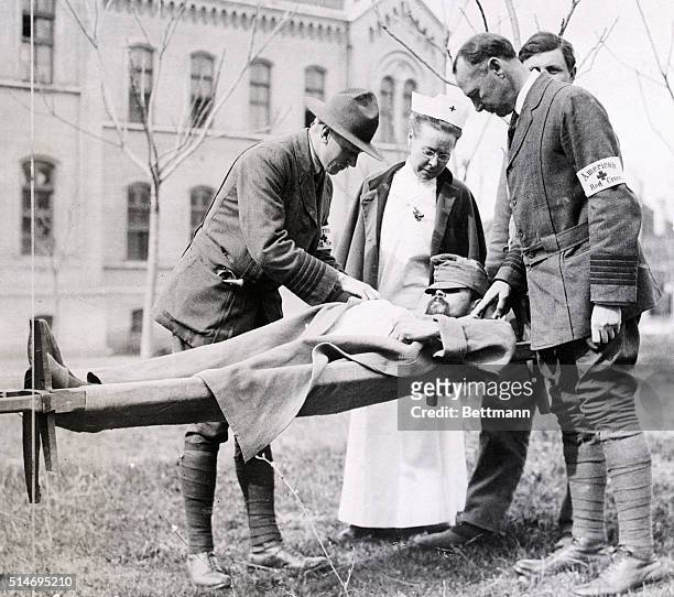 Dr. Kirby Smith, examining wounded Serbian soldier for signs of Typhus fever at Belgrade, Serbia. Undated photograph.