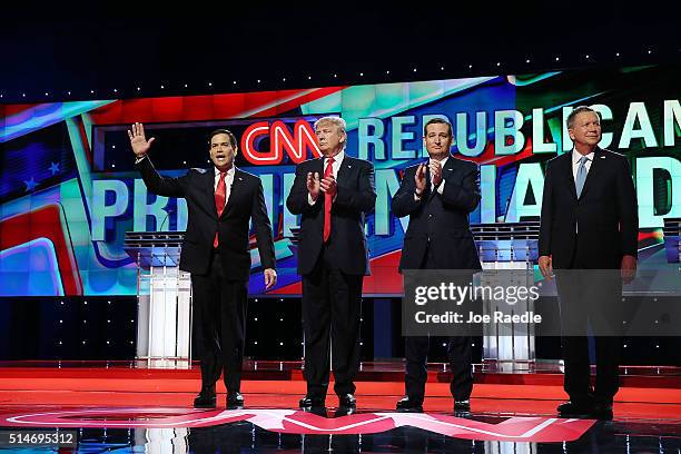 Republican presidential candidates, Sen. Marco Rubio , Donald Trump, Sen. Ted Cruz , and Ohio Gov. John Kasich arrive for the start of the CNN, Salem...