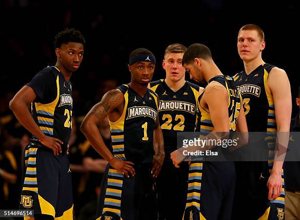 Jajuan Johnson,Duane Wilson,Wally Ellenson,Haanif Cheatham and Henry Ellenson of the Marquette Golden Eagles react late in the second half as they...