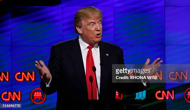 Republican Presidential candidate Donald Trump speaks during the CNN Debate in Miami on March 10, 2016. / AFP / RHONA WISE