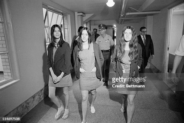Los Angeles, CA: Female defendants. The three female defendants in the Tate-LaBianca murder trial walk from the jail section to the courtroom as...