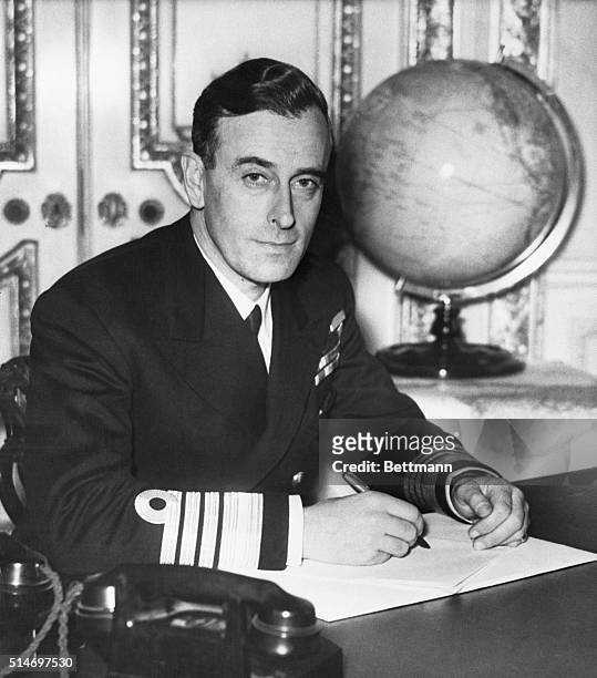 London, England. Lord Louis Mountbatten, newly appointed Supreme Allied Commander in Southeast Asia, is shown at work in his London headquarters. He...