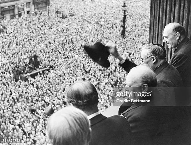 From a balcony in the Ministry of Health Building in Whitehall, Mr. Churchill addresses a huge crowd, 8th May 1945. Members of the cabinet were with...