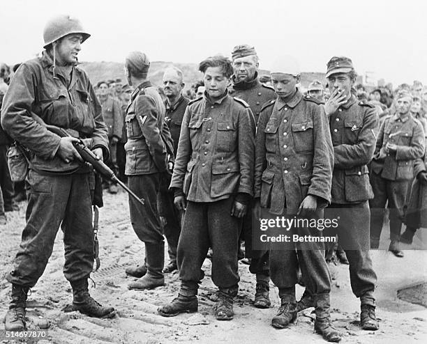France: The two youngsters in the foreground were captured with Germans along the allied beachhead in Normandy. While they appear to be about...