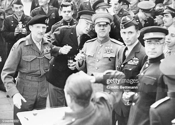 When Zhukov decorated Eisenhower and Montgomery with Russian order of Victory. Left to right about to drink toast, Montgomery, Eisenhower, Zhukov,...