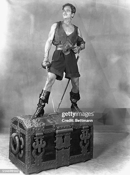Douglas Fairbanks, Sr., standing on treasure chest. From "Black Pirate." United Artists. Undated. BPA2# 3733