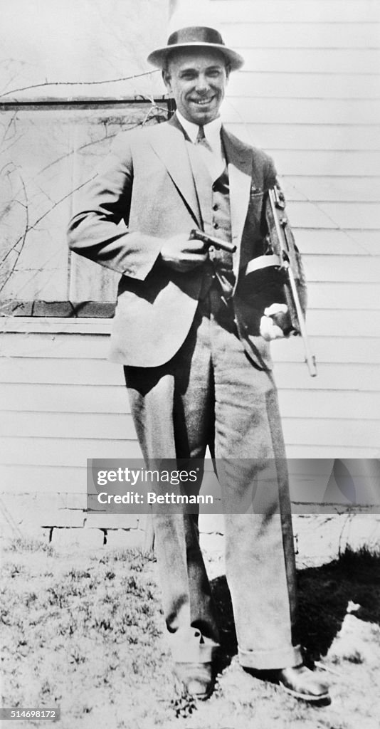 John Dillinger Poses with Machine Gun