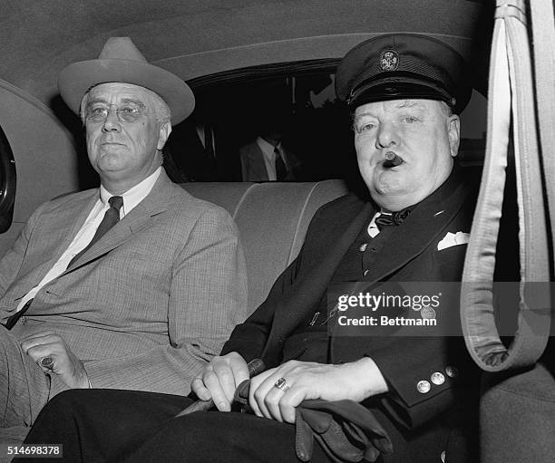 Prime Minister Churchill arrives at the White House with President Roosevelt. It is presumed that the two will discuss military plans for the...