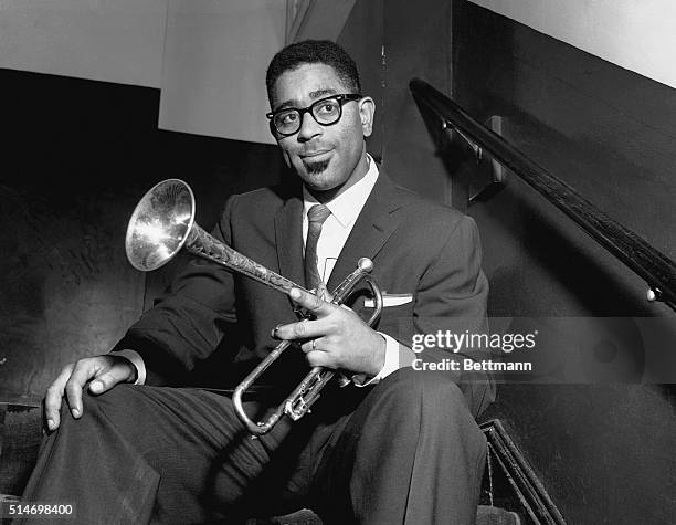 Portrait of trumpeter Dizzy Gillespie with his distinctive trumpet. He was known for his influence on the popular bebop style of jazz.