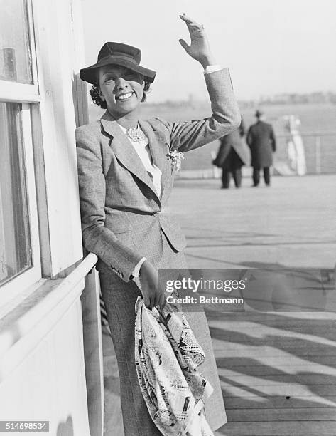 Dancer Josephine Baker arrives in Manhattan aboard the Normandie after a decade of living in Europe.