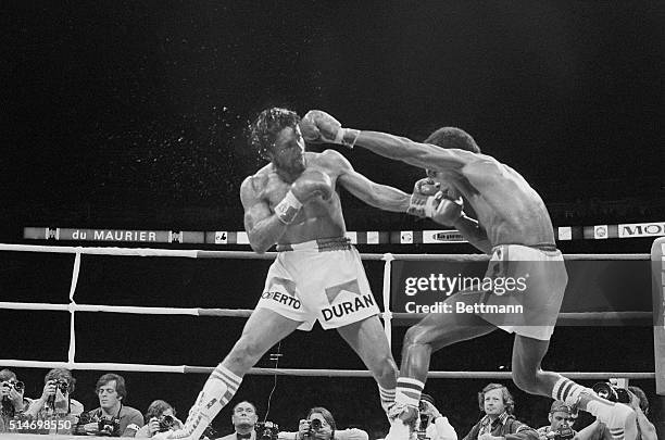 Montreal: Sugar Ray Leonard lets fly with a long left to Roberto Duran 6/20. UPI ld/Ron Kuntz