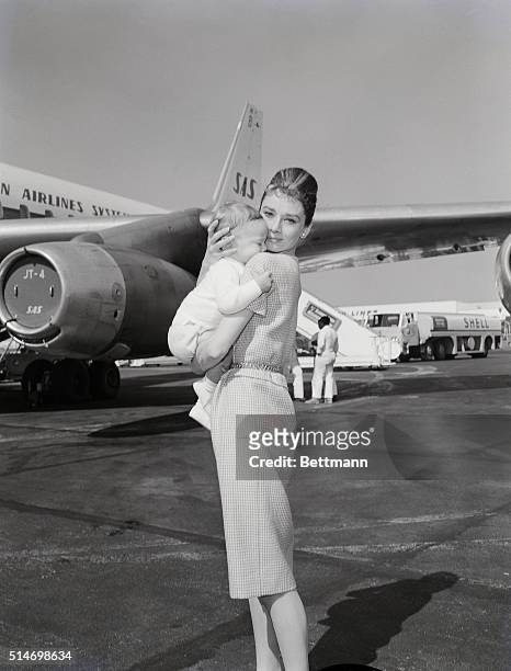 Los Angeles, CA: Actress Audrey Hepburn and son Sean, 7 months, leave for Rome via jetliner 2/21. She eventually will join husband Mel Ferrer in...