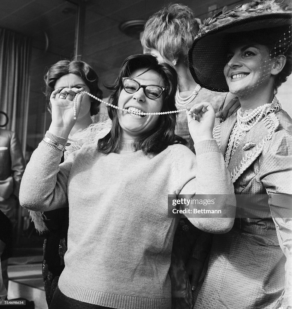 Nana Mouskouri Biting a String of Pearls