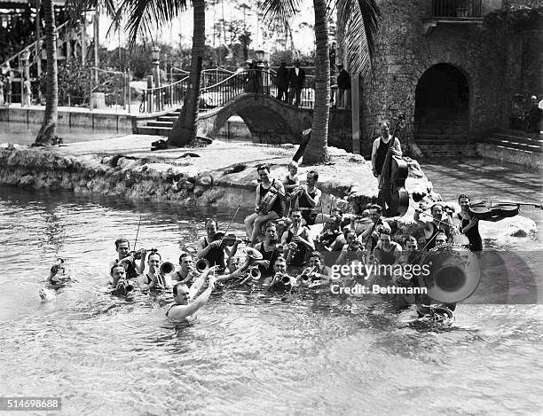 Coral Gables, Florida: In the beautiful Venetian Pool at Coral Gables, Fla., Paul Whiteman's celebrated jazz orchestra is shown here rendering that...