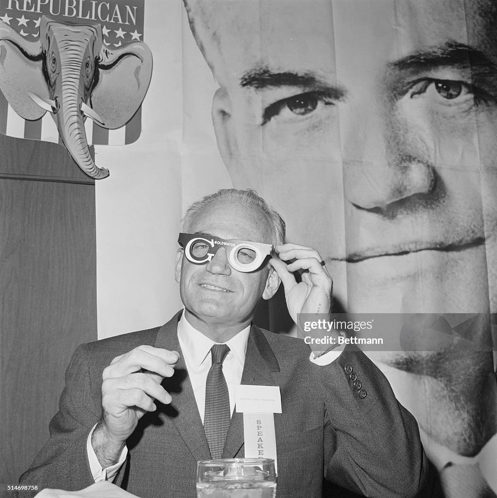 Senater Goldwater Tries on Glasses