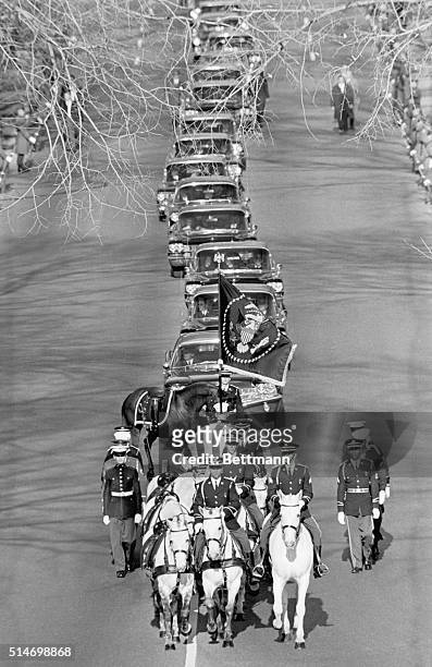 The caisson carrying the late President John F. Kennedy leads the funeral procession on November 22 on its way from St. Matthew's Cathedral to...