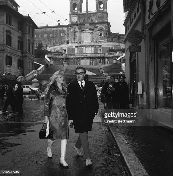 Rome, Italy: Rome's famed Spanish steps provide a scenic backdrop for British actor Peter Sellers and his wife, Swedish-born actress Britt Ekland, as...