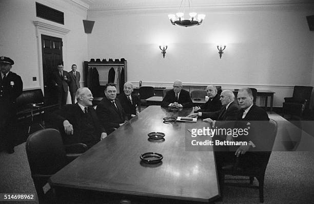 Chief Justice Earl Warren and other Washington luminaries at a table. The Warren Commission was appointed by President Johnson to investigate the...