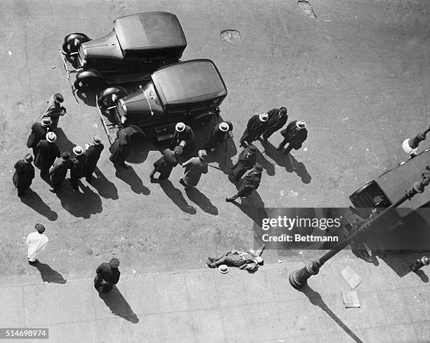 New York: Body of Ted Pandola, 30 year-old of 341 E. 104th Street, lying in the street, who was shot down by a man with whom he was walking in front...