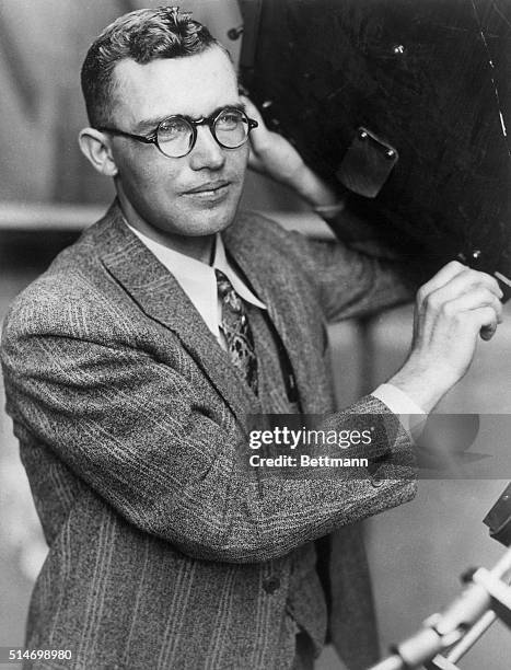 Flagstaff, AZ: Clyde W. Tombaugh,. Discoverer of the planet Pluto, who is postponing his college education in order that he may be able to complete...