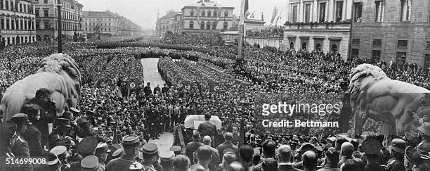 Munich, Bavaria . Herr Adolf Hitler,Chancellor of the Reich and head of the Nazi party of Germany is seen,with back to camera, in...