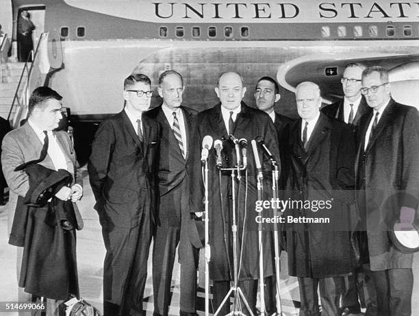 Members of the President Kennedy's cabinet speak to the press after learning of the president's assassination. The men had been en route to Japan...