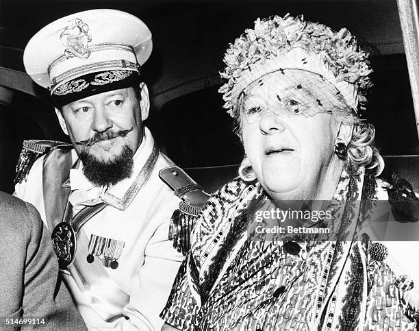 Margaret Rutherford, in costume as Grand Duchess Gloriana XII, ruler of the imaginary Duchy of Grand Fenwick, travels to Cape Canaveral for a...