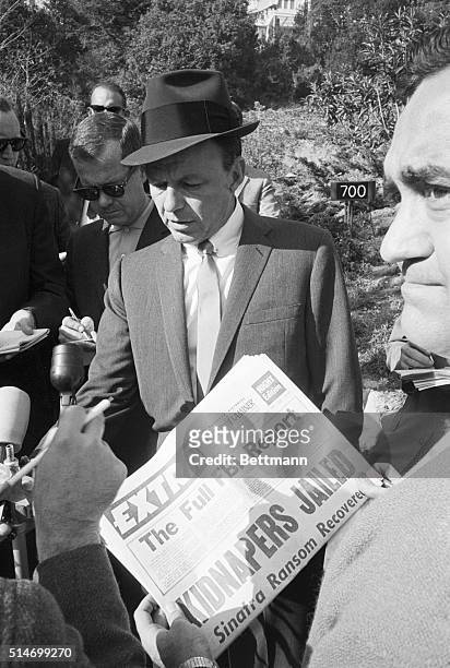 Frank Sinatra speaks at a press conference for the first time since the capture of the kidnappers of Frank Sinatra, Jr. In the driveway of his...