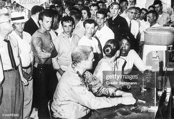 Segregation protesters Professor John R. Salter, Joan Trunpauer, and Annie Moody remain at a sit-in at a lunch counter in Jackson, Mississippi even...
