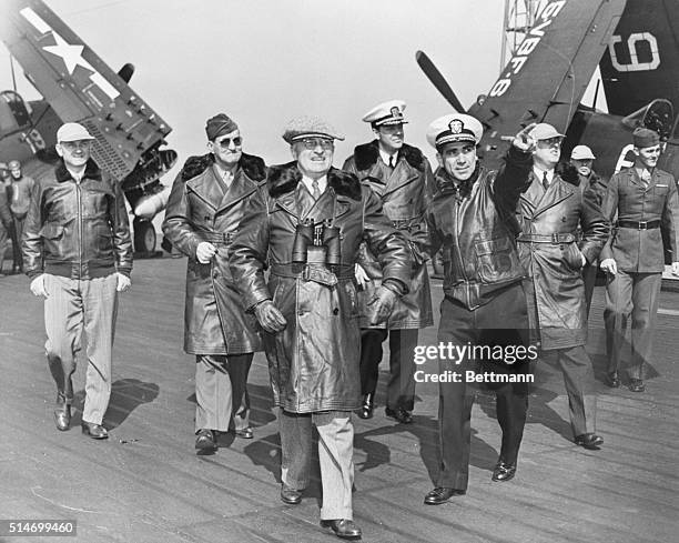 At Sea: President Truman is shown on the flight deck of the giant aircraft carrier USS Franklin D. Roosevelt as he watched the first post-war...