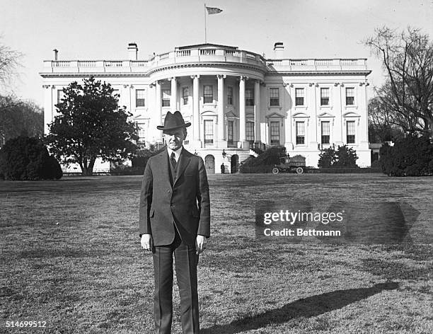 Washington, DC: The White House showing President Coolidge standing on the South lawn.