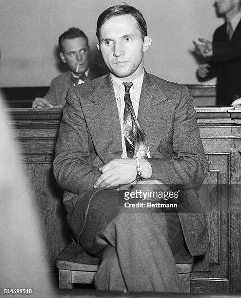 At the Greenwich Street police station, Bruno Hauptmann, main suspect in the Charles Lindbergh baby kidnapping, awaits questioning. He will be...