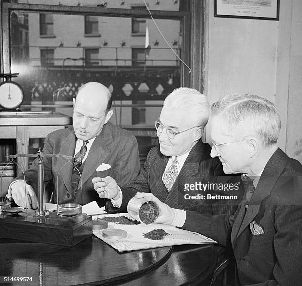 New York, NY: Government experts examine samples of tea from the first shipment to arrive in New York under a wartime agreement with Great Britain...