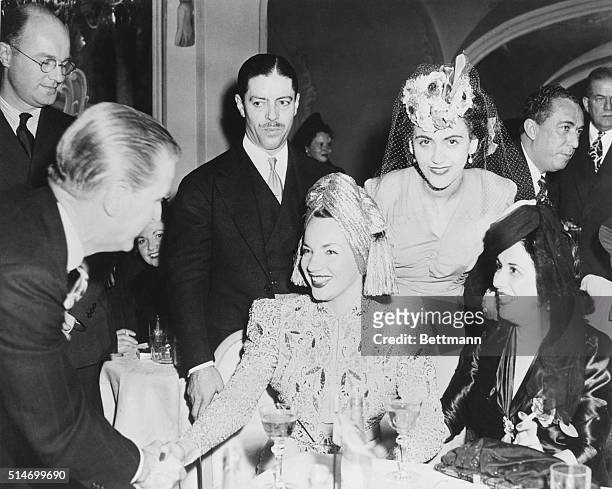 New York: Gorgeous Carmen Miranda in a gold turban is the big attraction here, at the "Cidade Das Mininas" held at the St Regis Hotel last night. Mme...