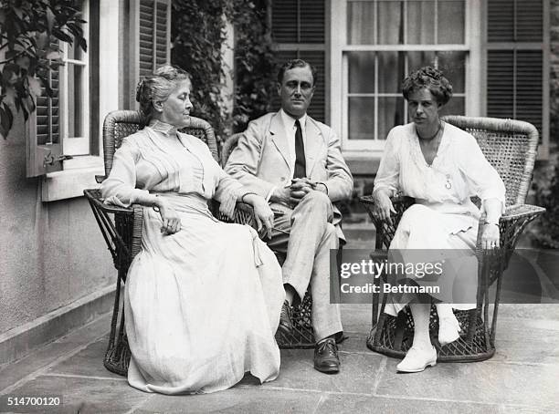 Assistant Secretary of the Navy Franklin Delano Roosevelt sits outside with his mother Sara and his wife Eleanor.