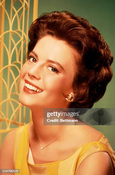 Natalie Wood is shown smiling in this head and shoulders posed photograph. Ca. 1950s-1960s.