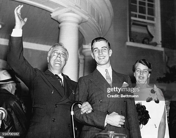President Roosevelt waves from his Hyde Park home with his son Franklin Jr. And First Lady Eleanor on the night of his re-election. His neighbors...