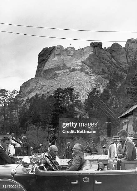 President Franklin Roosevelt talks with Mount Rushmore sculptor Gutzon Borglum during a trip to dedicate the sculpture of Thomas Jefferson. The...